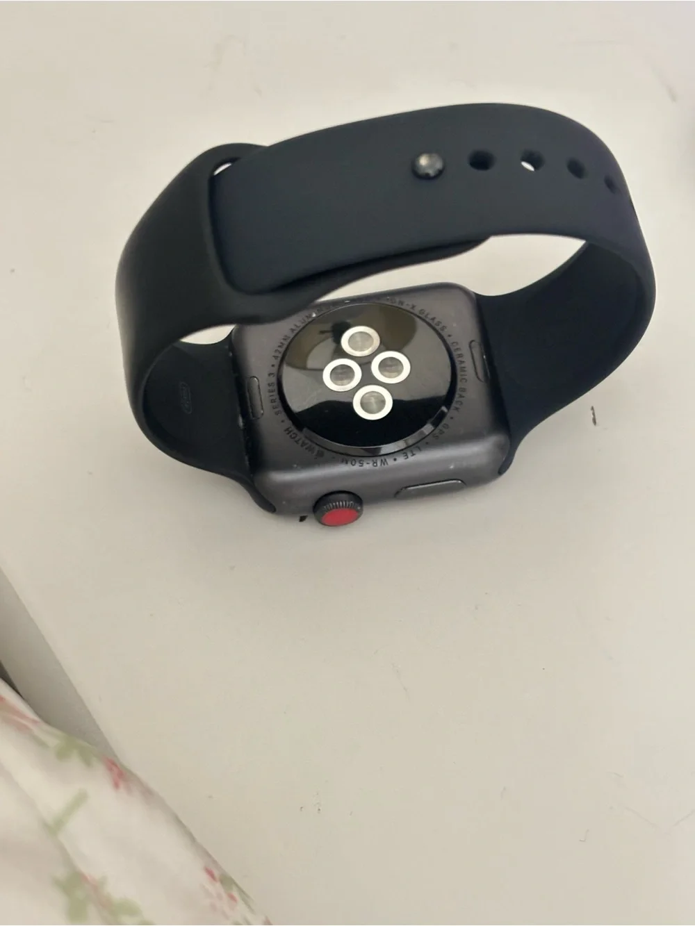 Apple Smartwatch in Space Gray with Black Band and Red Digital Crown